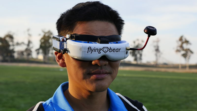Ken Loo, a drone racing pilot, wears First Person View goggles which allow the pilot to see an analog video feed from the drone in flight.