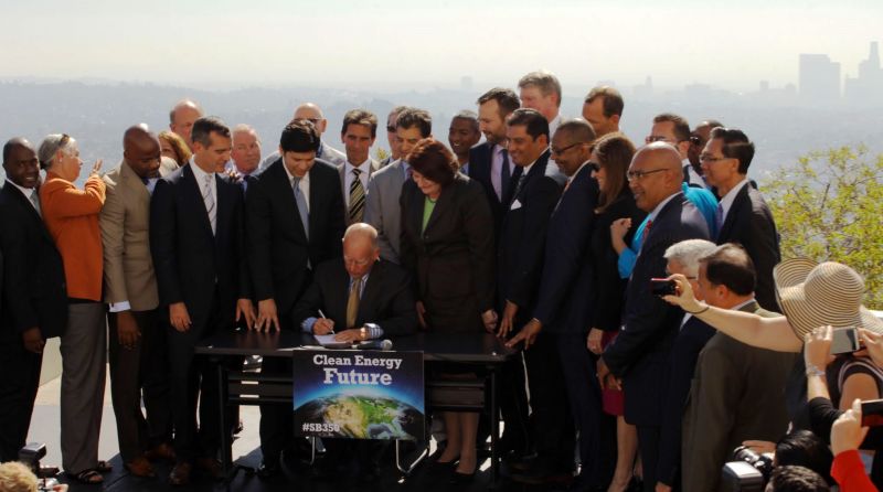 Governor Jerry Brown signs SB 350 at Los Angeles' Griffith Observatory in October 2015.