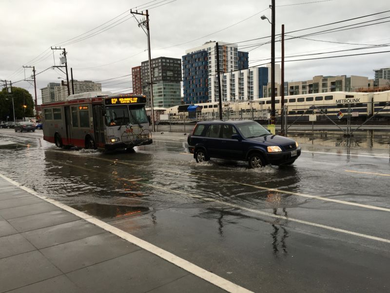 Traffic plows through flood waters in San Francisco during early January rains.