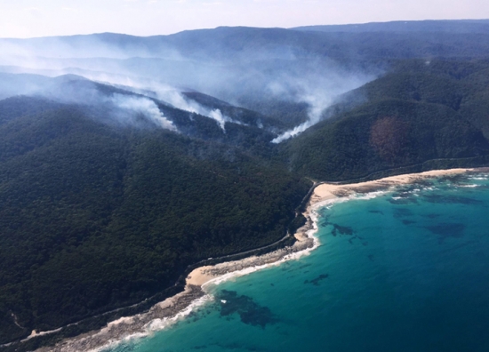 A wildfire burns along the Great Ocean Road in Victoria, Australia in December 2015.