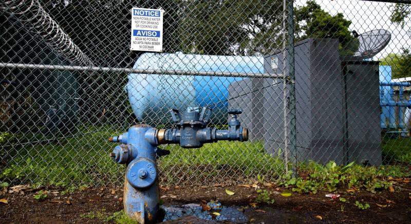 A sign warns not to drink the water at the Gloria Way well in East Palo Alto. The city hopes in 2017 to begin construction on a new well here to use groundwater to augment water supply. 