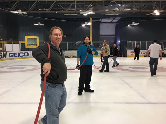 Bay Area curlers flood the ice at the Sharks Ice Facility in Fremont during a course with Jamie Bourassa, one of the world's best curling ice technicians. They need to make the surface as level as possible for the curling tournament. 