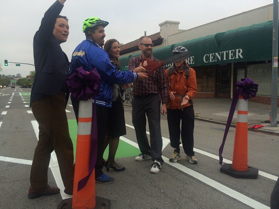 Oakland Mayor Libby Shaaf, Oakland City Council member Abel Guillén, Piedmont City Council member Timothy Rood and Bike East Bay's Renee Rivera cut the ribbon to celebrate a new dedicated bike lane.