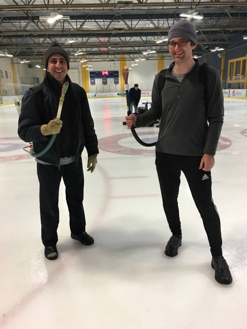 Armed with water-filled backpacks, pebblers spray water droplets across the entire court in the early hours before the 2016 Golden Gate Bonspiel. The droplets freeze into icy pebbles, over which the curling stones glide. 