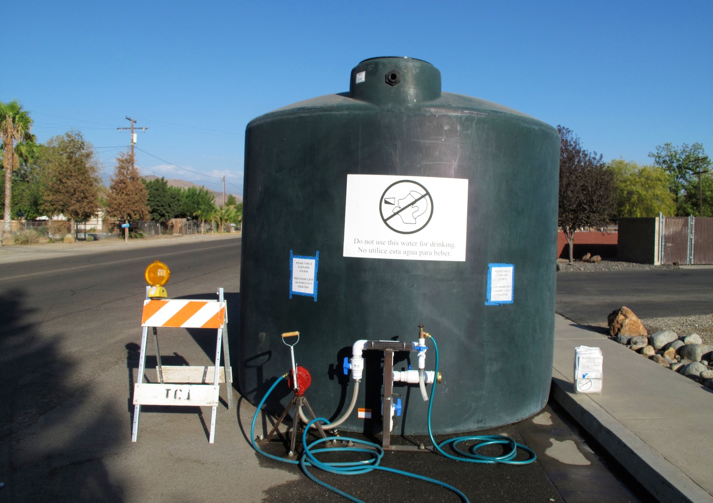 Residents whose wells have run dry can draw water from this 5,000-gallon (18,900-liter) water tank in East Porterville, Calif. The health department recently completed a survey about the impacts of the drought on East Porterville and a neighboring community.