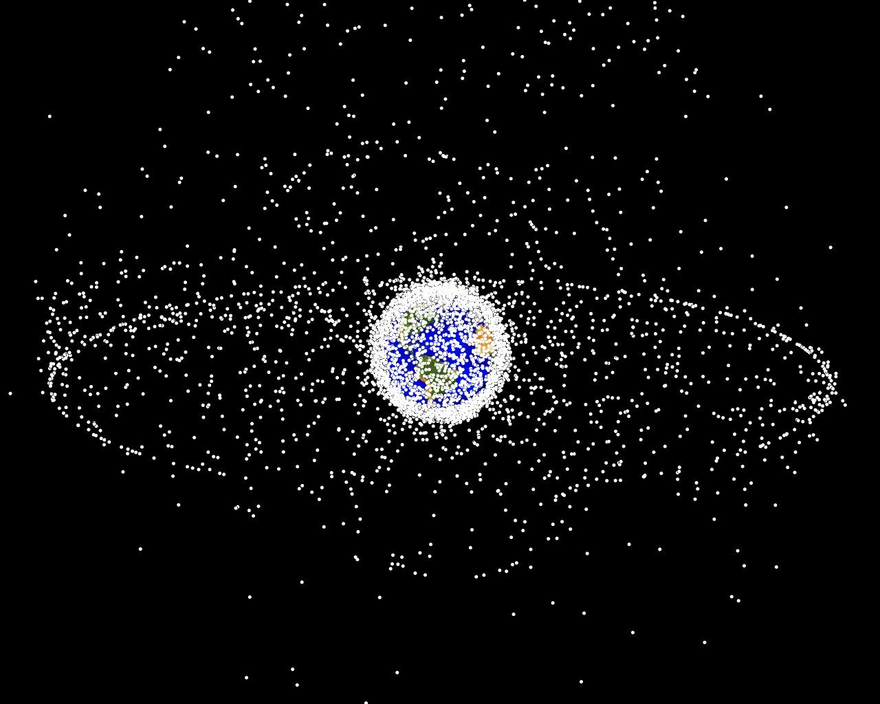 NASA plot of satellites in orbit around Earth. The ring consists of satellites at the geosynchronous distance (26,000 miles), and the dense shell of dots near Earth are satellites in low-Earth-orbit. 