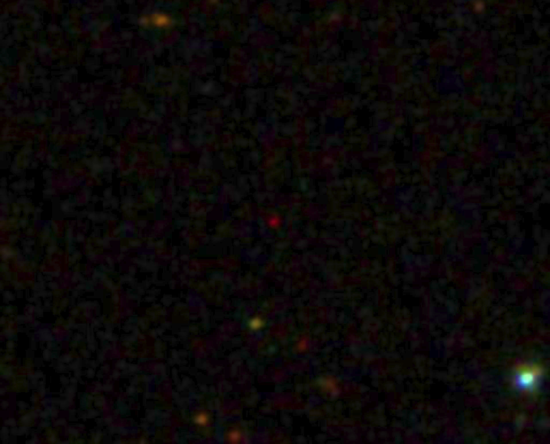 The QUASAR SDSS J0100_2802 (reddish dot at center), one of the brightest and most distant Active Galactic Nuclei in the universe.
