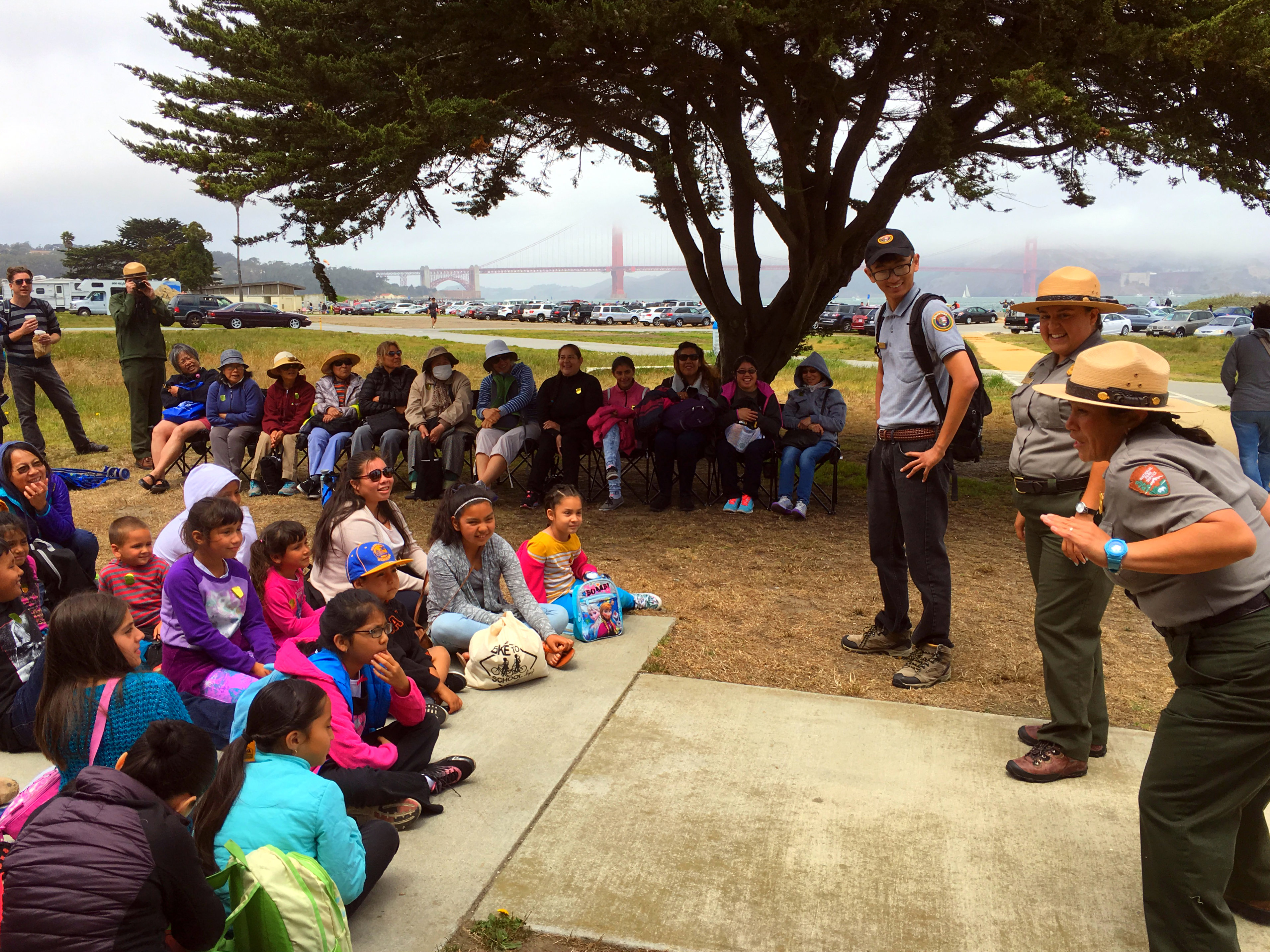 Park rangers explain flora and fauna at Chrissy Field to a group of visitors from the Mission District who took free shuttles to Chrissy Field. 