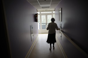 A woman, suffering from Alzheimer's Disease, in a retirement home corridor. (Sebastien Bozon/AFP/Getty Images)