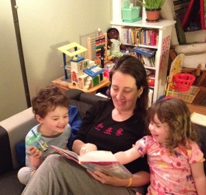 Karen Witham reads to her children, giving her husband a chance to recharge.
