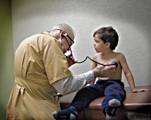 This 2009 photo shows the 83-year-old doctor examining the photographers's son. (Laura4Smith:Flickr)