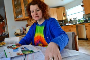 Kimberley Macgregor, a bookkeeper at a Burbank Ralphs, looks over which “healthy activities” she’ll do to offset her health care costs. She says she didn’t know about the new wellness program until KQED contacted her. (Photo: Kelley Weiss)