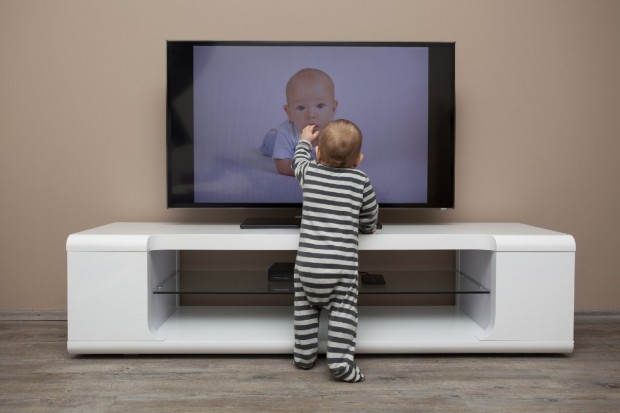 It's easy to imagine how this baby could be hurt if the TV toppled over. (Getty Images)
