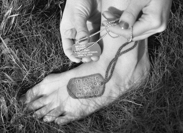 A commemorative Army dog tag similar to the one worn by Caitlin's father, was designed by her aunt and passed out at Richard Bryants' funeral service. Caitlin recently had a tattoo artist replicate one on her foot. (Photo by: Margarita Brichkova)
