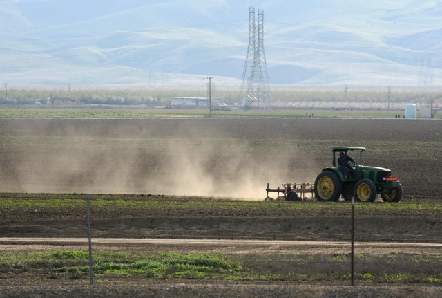 Fungal spores that cause valley fever are carried in the dust. Activities including farming in the Central Valley contribute to the spread of the spores. (Robin Beck/Getty Images)