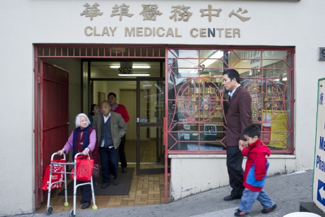 CCHP's motto, "caring for generations," in action at the entrance to Dr. Gustin Ho's medical practice in Chinatown. (Marcus Teply/KQED)