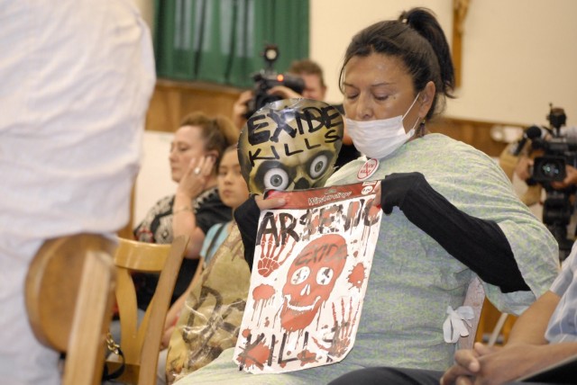 Doelores Mejia attended a recent public meeting in Boyle Heights where state Department of Toxic Substances Control officials described neighborhood lead contamination. Mejia says state officials should have closed the plant long ago. (Chris Richard)