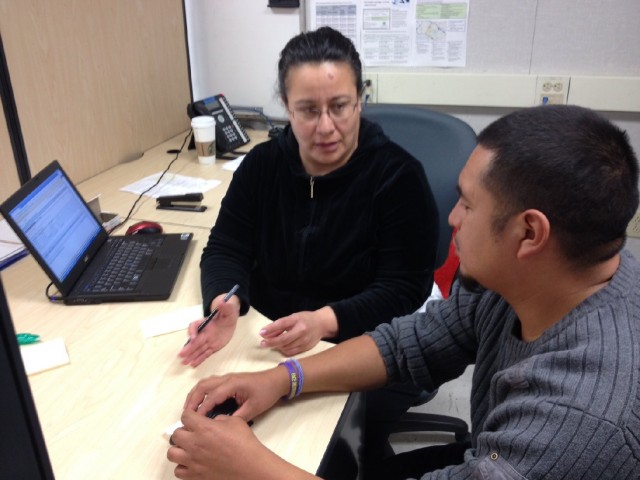 Gabino Pablo gets help with Covered Calfiornia enrollment as the deadline approaches. (Rachel Dornhelm/KQED)
