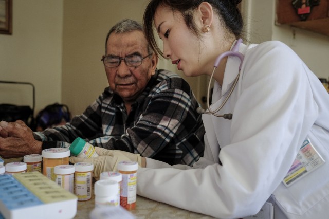 Dr. Sarah Ma goes over medications and dosages with diabetes patient Joe Navarro. (Credit: Anacleto Rapping)