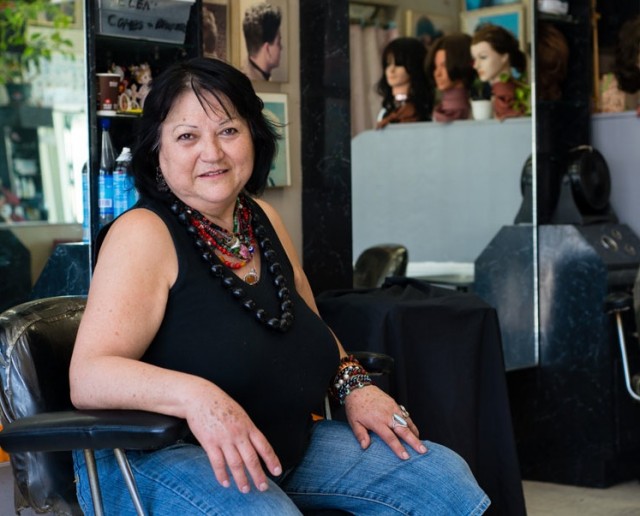 Teresa Martinez, 62, works as a hairdresser at a Koreatown hair salon. She earns about $10,000 per year and cannot afford to buy private health coverage (Photo by Heidi de Marco/KHN).