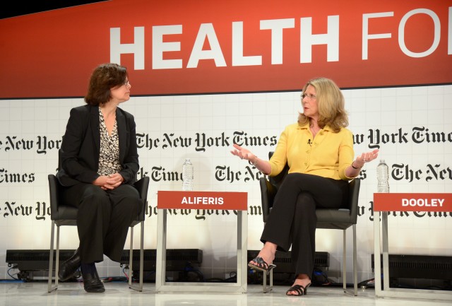 Diana Dooley (right), Secretary of California's Health and Human Services Agency, talks with KQED's Lisa Aliferis about the Affordable Care Act at a New York Times conference at UCSF. (Michael Loccisano/Getty Images for New York Times)