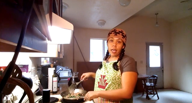 Meagan Baldy demonstrates a stir-fry of local salmon, kale and mushrooms. (screen grab from YouTube)