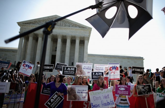  Anti-abortion advocates rally in front of the Supreme Court awaiting the decision in Burwell v. Hobby Lobby Stores was announced Monday. (Chip Somodevilla/Getty Images)