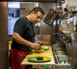 Jorge Castaneda, a cook at Lopez's restaurant has been uninsured most of his adult life. The 47-year-old says he hardly gets sick, but is waiting for his employer to offer health insurance (Heidi de Marco/Kaiser Health News).