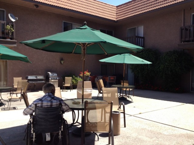 Taking some fresh air in the courtyard at Westchester Villa, an assisted facility in Inglewood. (Rachael Myrow/KQED)