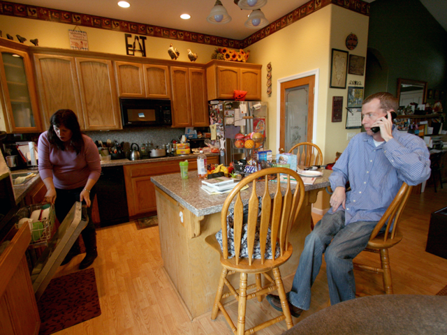 Stacey and Kory Felker in their Quincy, California home. The Felkers live near the California-Nevada border, and recently learned that their individual insurance does not cover routine out-of-state care. (Pauline Bartolone/Capital Public Radio)