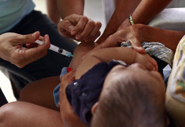 Babies get their first whooping cough vaccine at 2 months. (Kenneth Pornillos/World Bank via Flickr)