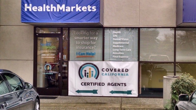 Sign outside a health insurance agency which seeks to lure customers on their way to the Sunvalley mall in Concord. (Marc Protenic/Health Markets)