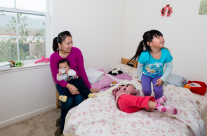 Cecily Liu, 37, with her three children. (Heidi de Marco/Kaiser Health News)