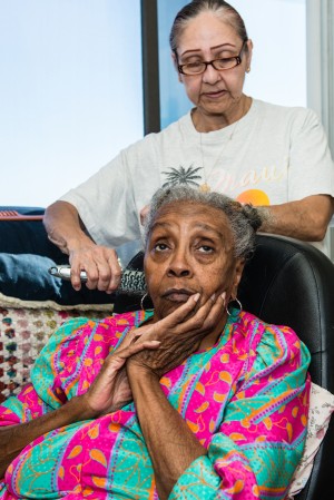 Maggie Belton suffers from arthritis and diabetes. The 82-year-old gets in-home care from Armida Pineda, 64, at her Pasadena apartment. (Heidi de Marco/KHN)