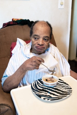 Charles Massengale can eat by himself, but needs help with everything else. The former tree trimmer has severe brain damage from a 30-foot fall, as well as dementia, diabetes and high blood pressure (Heidi de Marco/KHN).