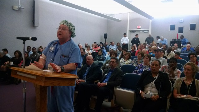 Stephen Scotty, who works at Doctors Medical Center's cardiac catheter lab addresses the board. (Andrew Stelzer/KQED)