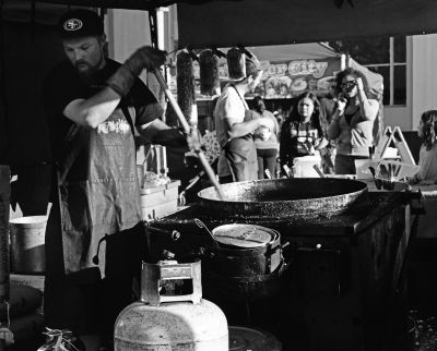 James stirs a vat of kettle corn at the Watsonville Farmer's Market.