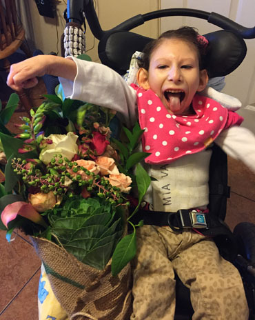 Mia Vasquez, 8 , has cerebral palsy and bone deformities.