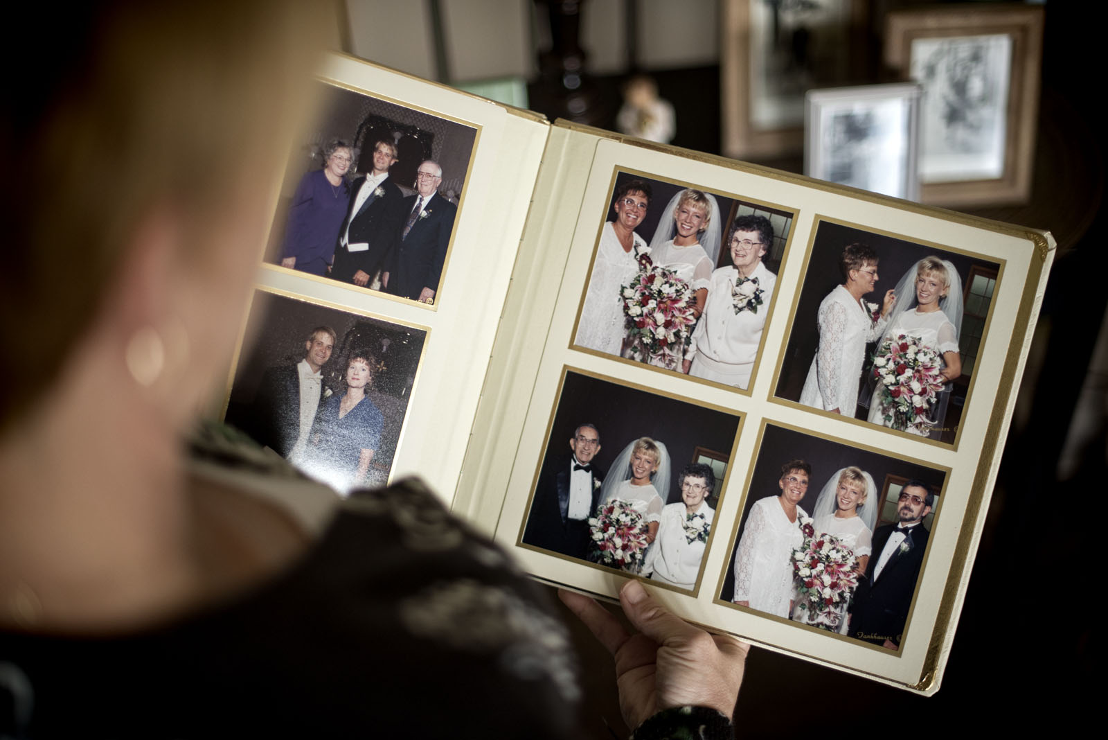 Kristin Sigg looks at wedding photos that include her mother. 