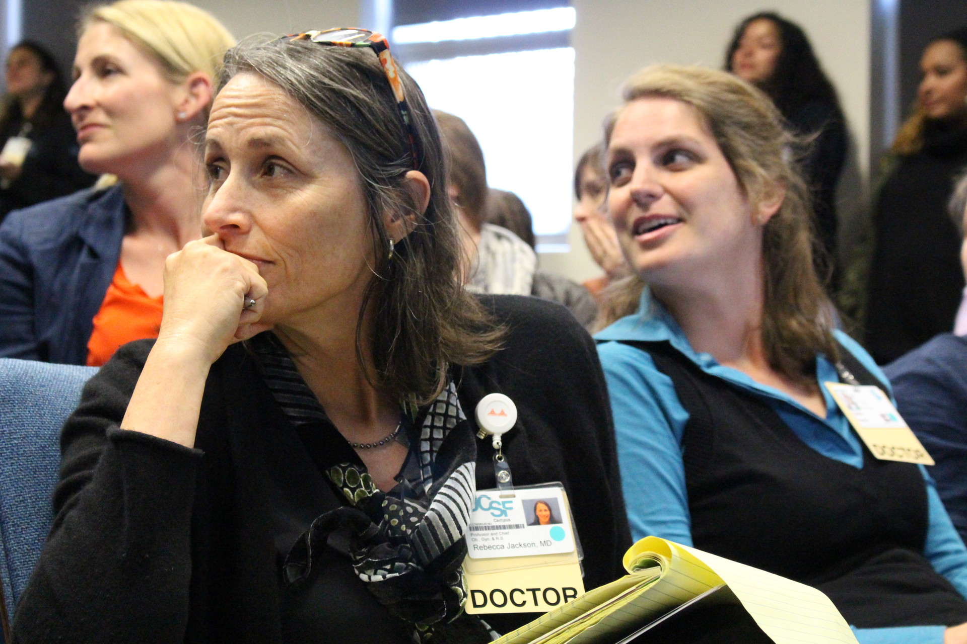 Dr. Rebecca Jackson, New Generation's main supervisor, and Dr. Valerie French (right), medical director, listen to speakers at a community forum in April about the potential closure of New Generation. After the meeting, Jackson said she was hopeful New Generation could find more funds to stay open "given the huge outpouring of concerned people." 