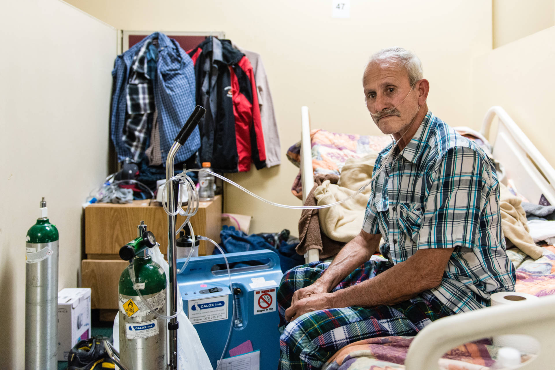Victor Ramirez, 61, uses his ventilator at the men’s dorm at the Illumination Foundation Recuperative Care in Santa Fe Springs, Calif.