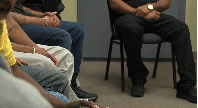 Members of the Drug Court program participate in a 12-step meeting.