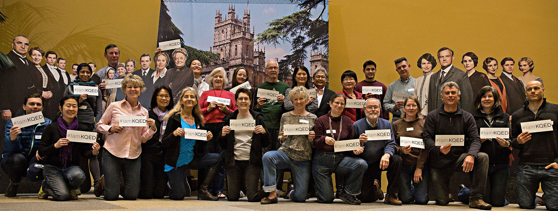 KQED Pledge Volunteers Standing in front of Downton Abbey backdrop