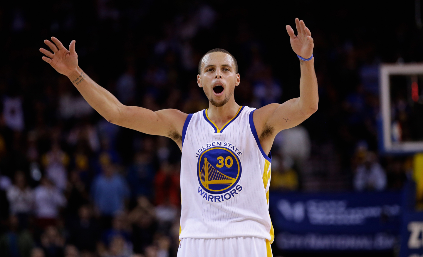 Stephen Curry tries to get the crowd louder during the fourth quarter of their game against the Houston Rockets at ORACLE Arena on December 10, 2014 in Oakland, California. (Ezra Shaw/Getty Images)