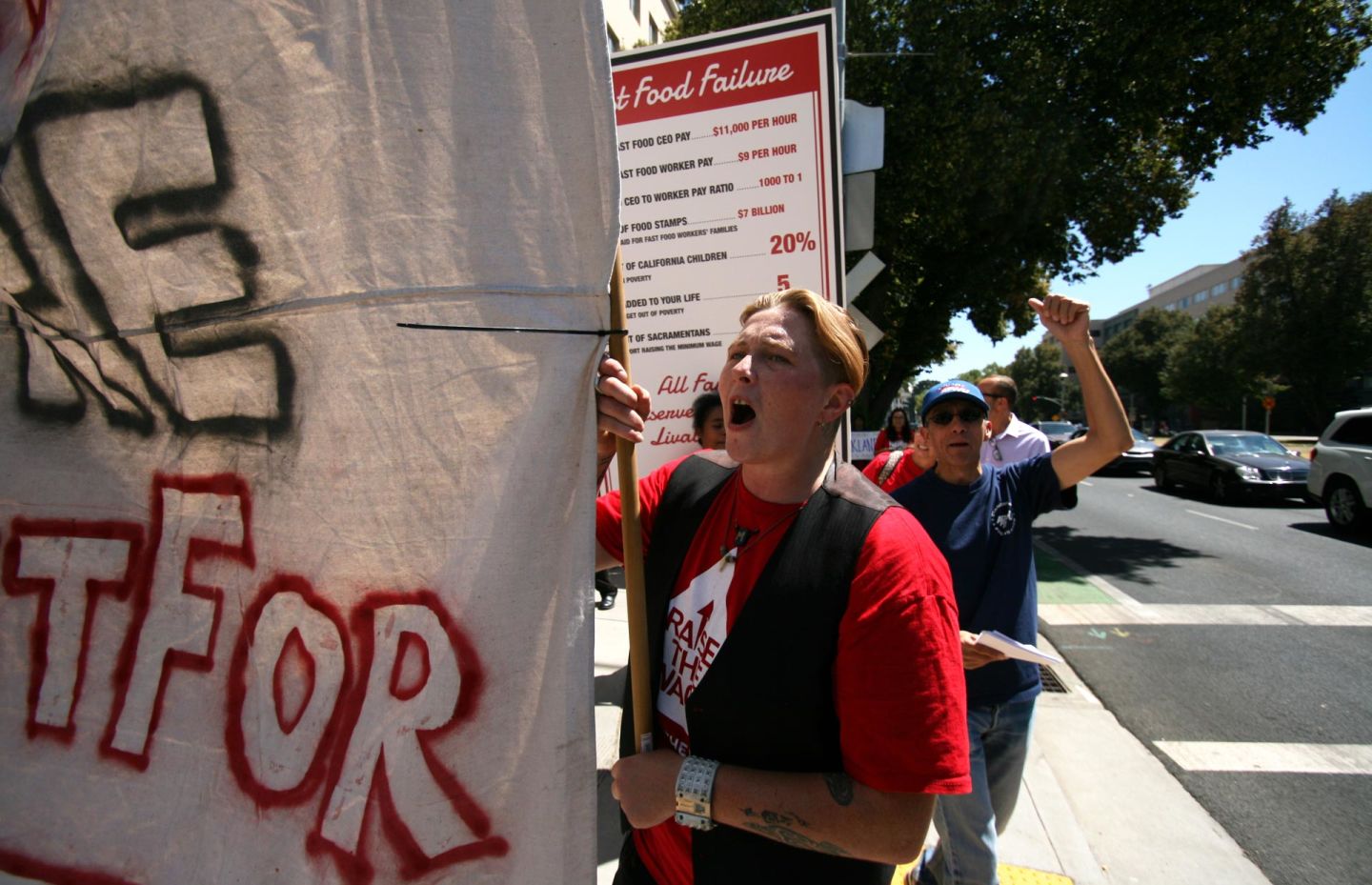 Fast-food workers with the Fight for $15 movement rallied in Sacramento for higher wages in August 2015. Pauline Bartolone/CALmatters