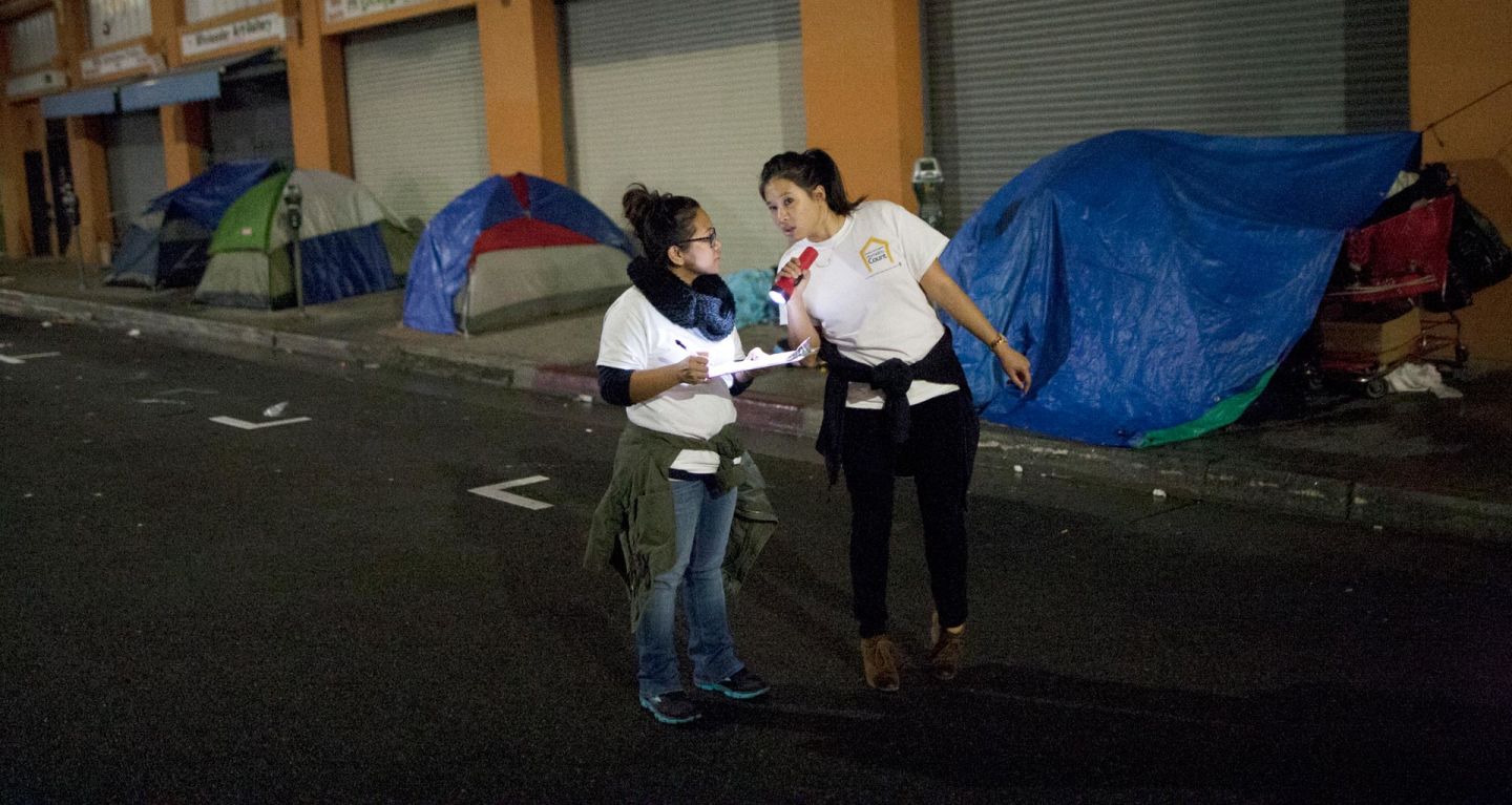 Thousands of people have fanned out across L.A. County this week for the region’s three-day homeless count. That includes tallying the scores of people living on the streets of downtown’s Skid Row, pictured here as volunteers conduct the 2015 homeless count. David McNew/Getty Images