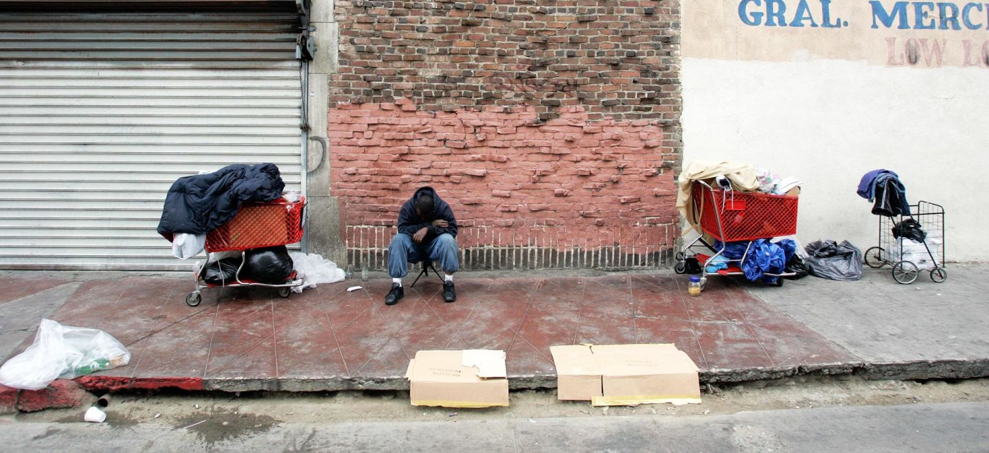 A homeless man waits to get in line for food distribution in Los Angeles.  Hector Mata/AFP/Getty Images