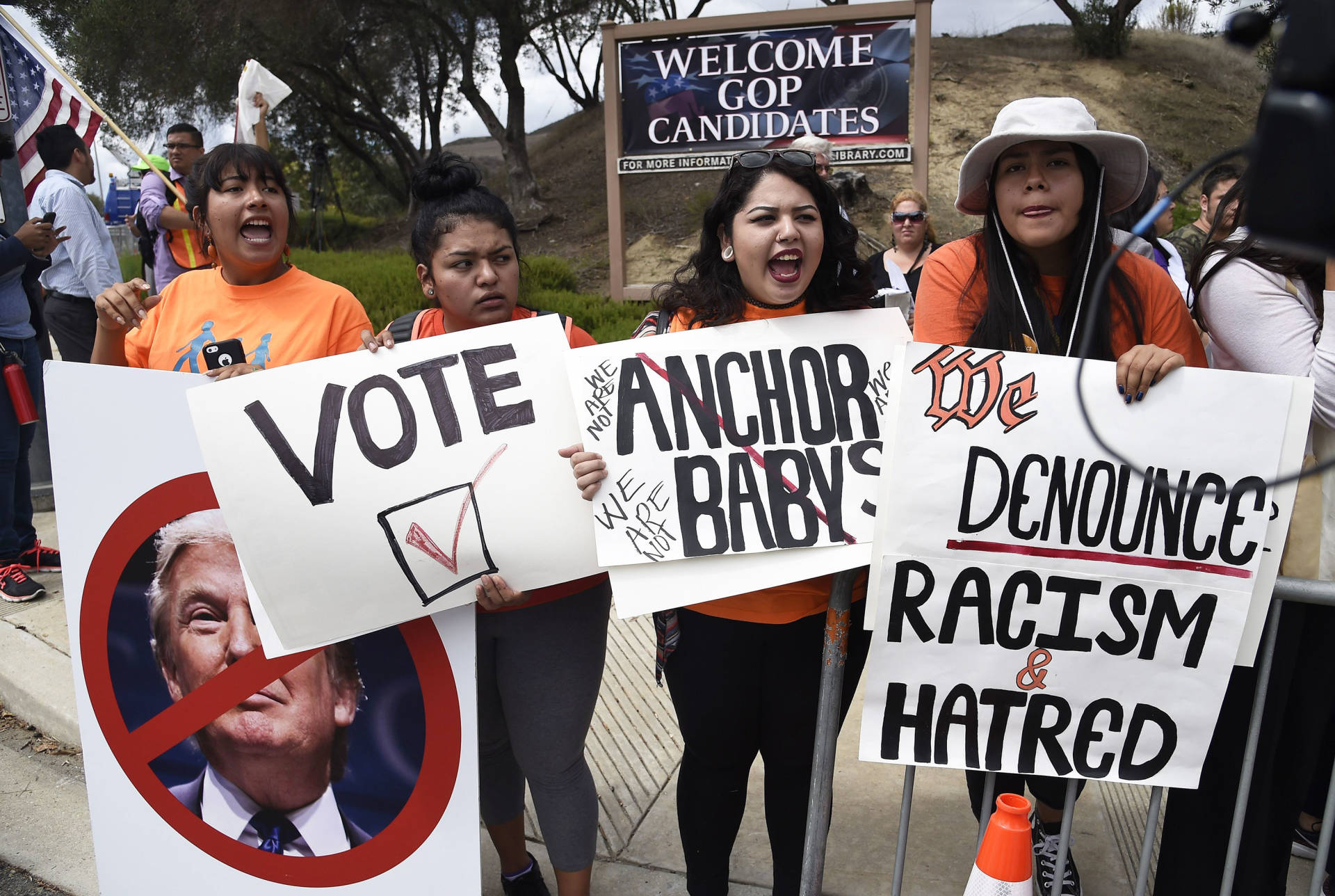 Latinos, immigration and workers' rights advocates and their supporters protest against Donald Trump and other Republican presidential hopefuls, outside a debate at the Ronald Reagan Presidential Library in Simi Valley on September 16, 2015. ROBYN BECK/AFP/Getty Images