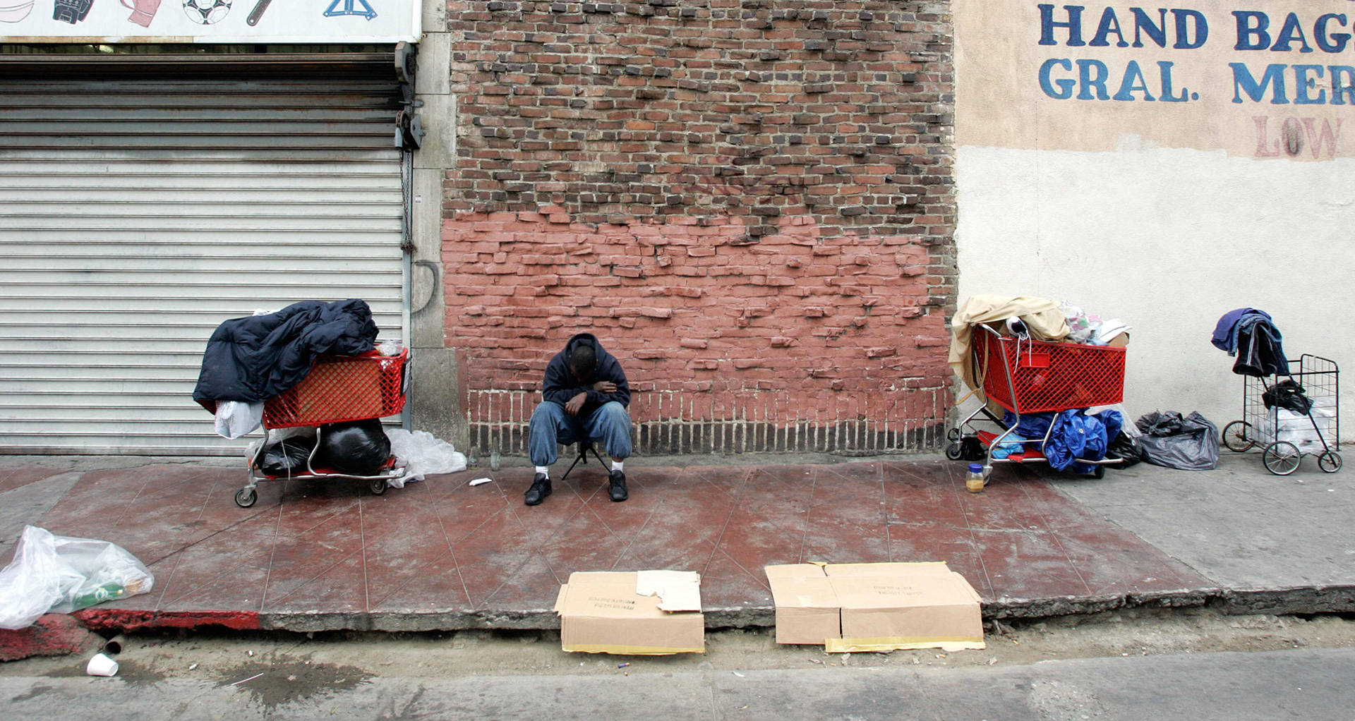 A homeless man waits to get in line for food distribution in Los Angeles. HECTOR MATA/AFP/Getty Images