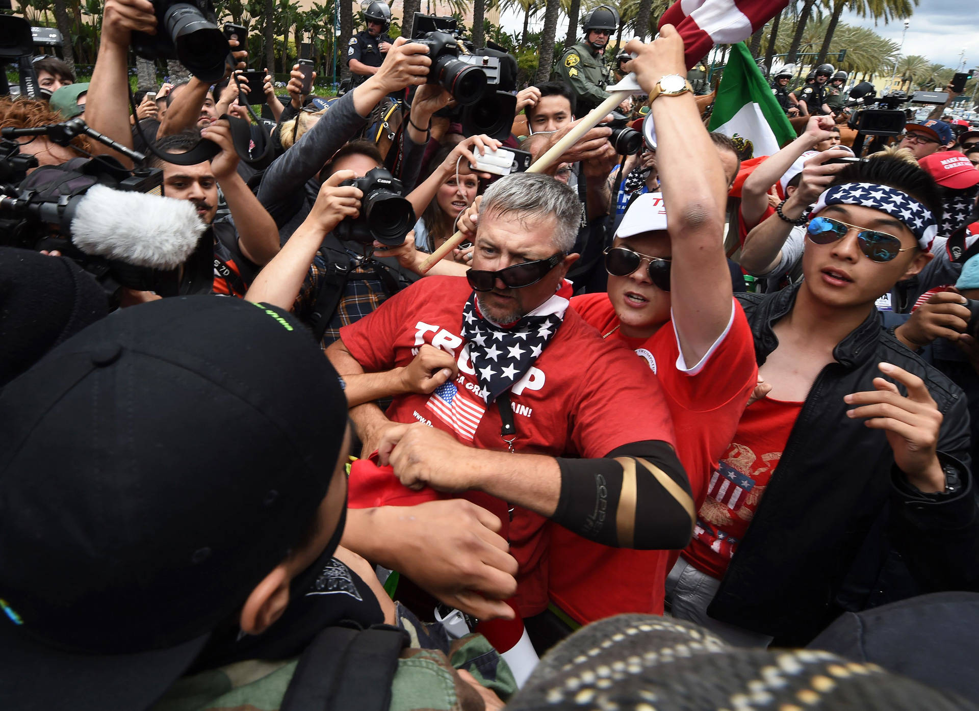 Anti-Trump protesters (L) clash with Donald Trump supporters (C) outside the Anaheim Convention Center on May 25, 2016. Mark Ralston/AFP/Getty Images